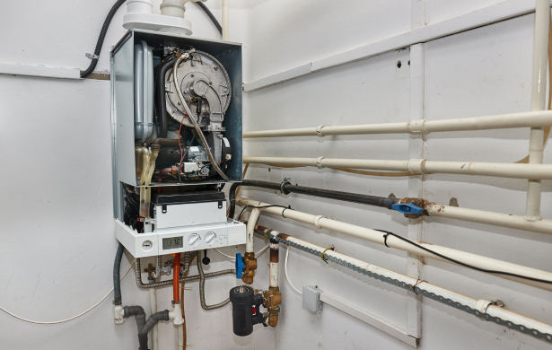 Gas Boiler Installation with Exposed Internal Components