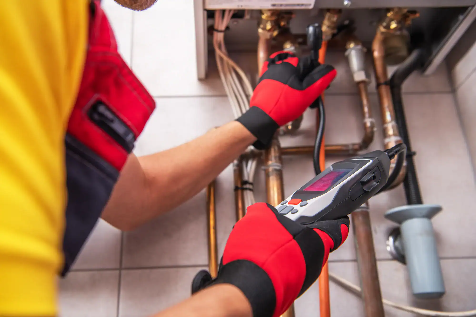 Technician fixing a heating system in Essex County, New Jersey.